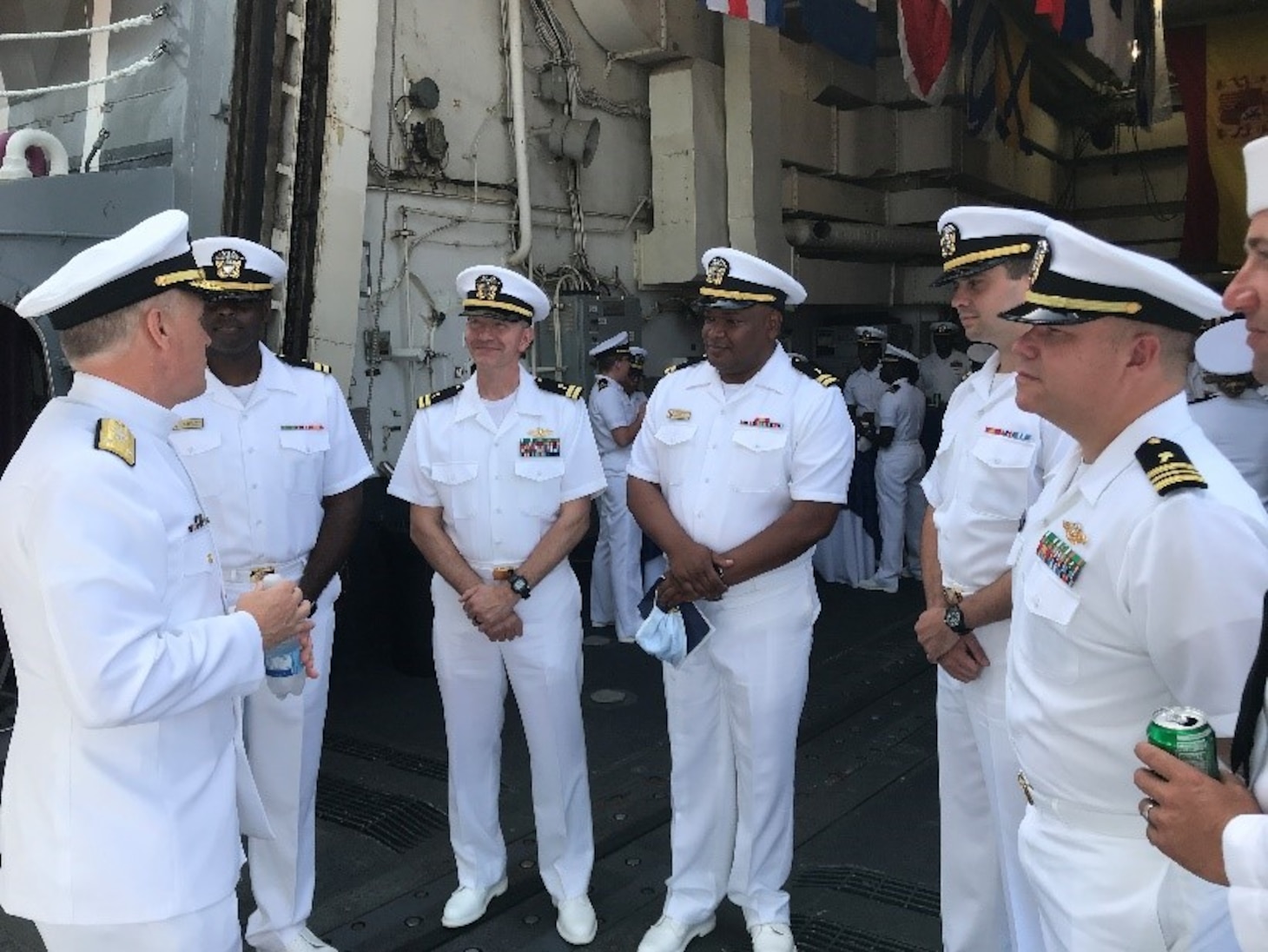 Vice Adm. Gene Black, Commander, U.S Sixth Fleet, left, speaks with chaplains assigned to Destroyer Squadron (DESRON) 60 during the DESRON 60 change of command in Rota, Spain, Aug. 10, 2021.