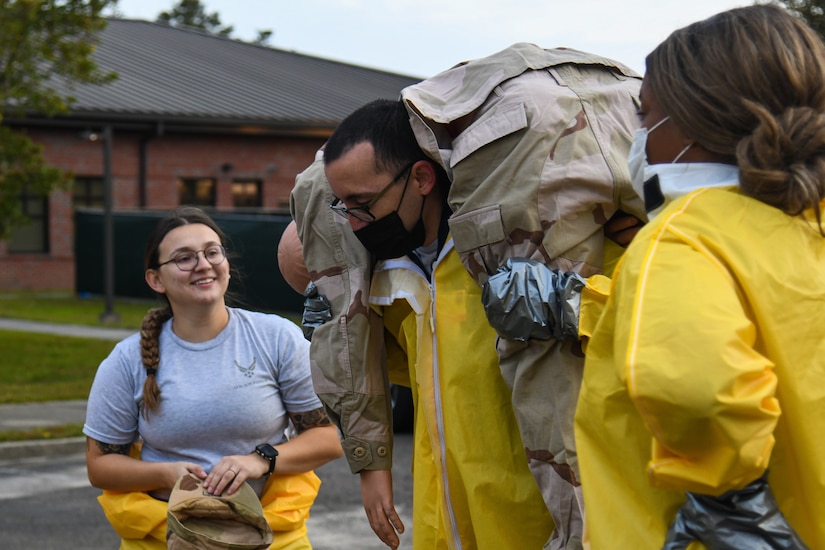 An Airman assigned to the 628th Medical Group carries a simulated patient during a Decontamination Training Exercise at Joint Base Charleston, S.C., Nov. 4, 2021.