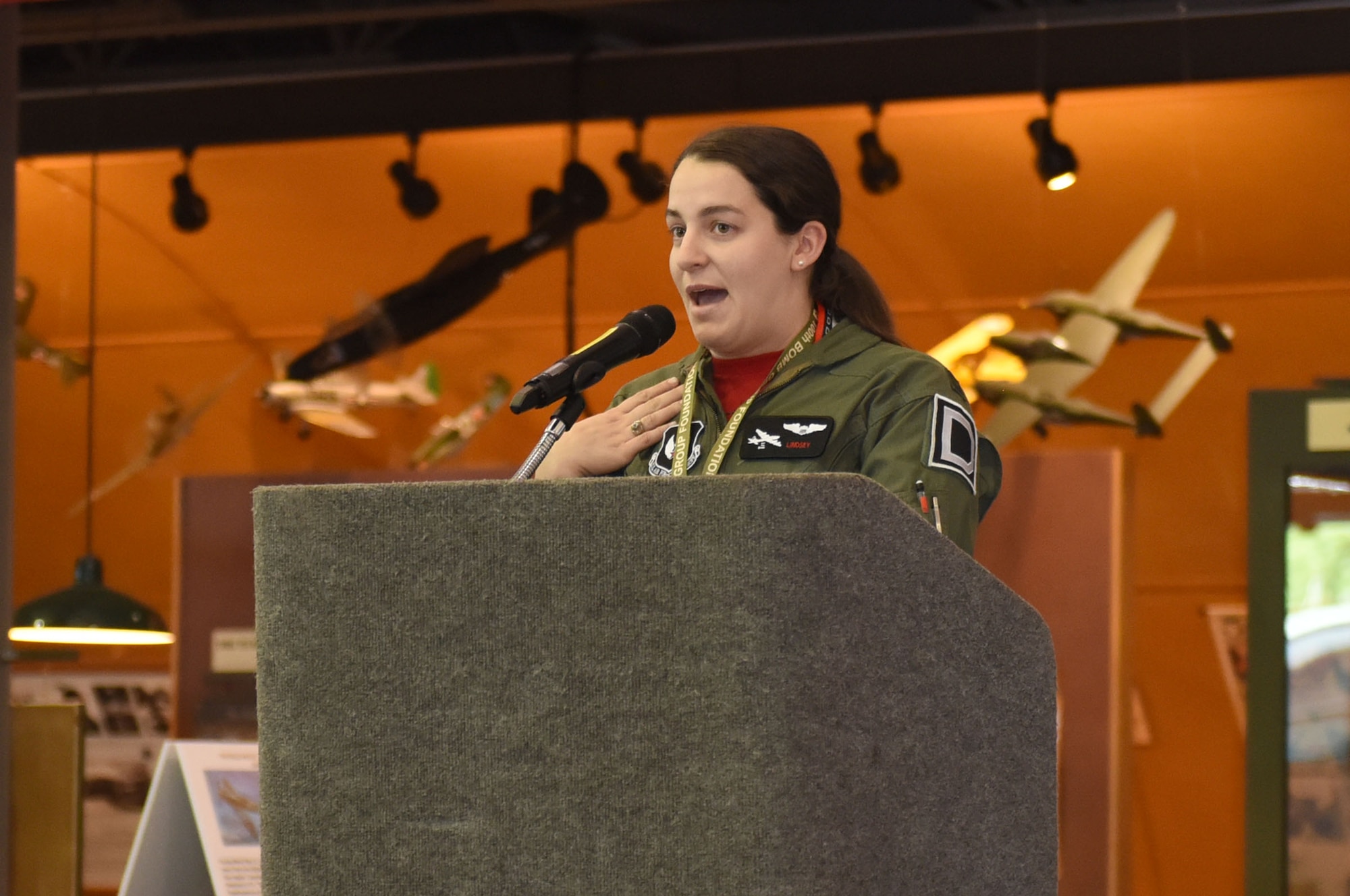 U.S. Air Force Capt. Lindsey Summerlin, 351st Air Refueling Squadron KC-135 Stratotanker pilot, shares her experience in the U.S. Air Force and tells how Women Airforce Service Pilots, also known as WASPs, influenced her decision in joining the military as a pilot during a speech at the Frontiers of Flight Museum as part of the 100th Bomb Group reunion in Dallas, Texas, Oct. 29, 2021. The WASPs were civilian volunteers who flew military aircraft stateside during World War II, and ferried and tested aircraft so male pilots could head to combat duty. (U.S. Air Force photo by Karen Abeyasekere)