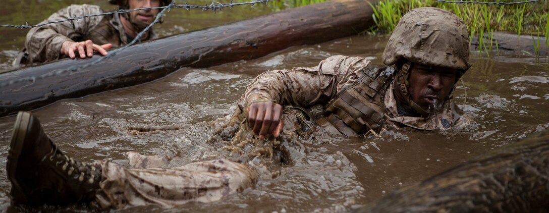 U.S. Marines assigned to Officer Candidate School (OCS) participate in the Combat Course aboard Marine Corps Base Quantico, Va., May 11, 2016. The mission of OCS is to educate and train officer candidates in order to evaluate and screen individuals for qualities required for commissioning as a Marine Corps officer. (U.S. Marine Corps Combat Camera photo by Cpl. Laura Mercado/Released)