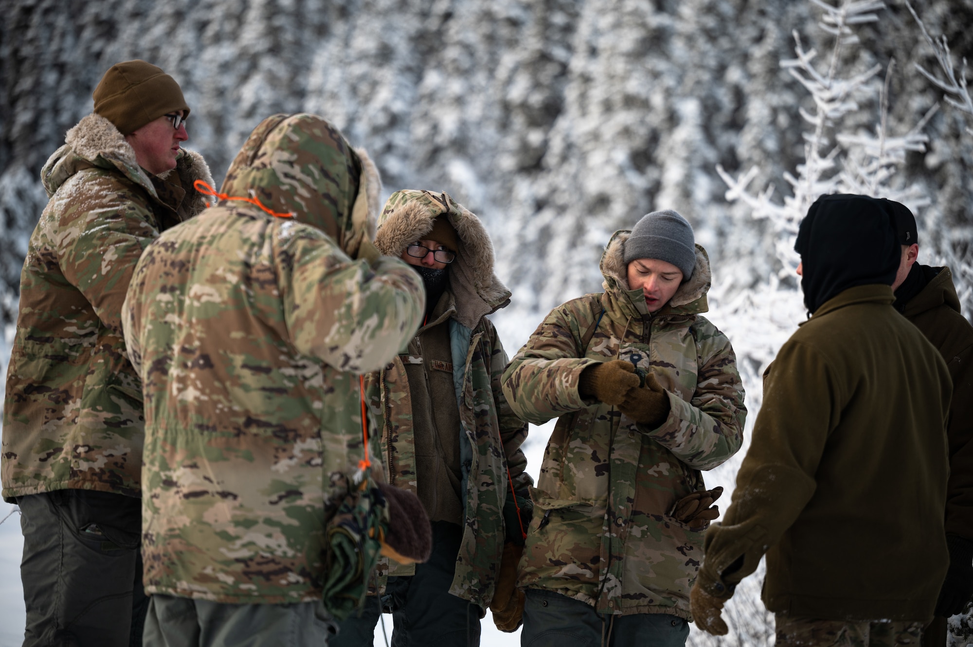 U.S. Air Force Arctic Survival Training students practice vectoring an aircraft during a recovery exercise on Eielson Air Force Base, Alaska, Nov. 18, 2021.