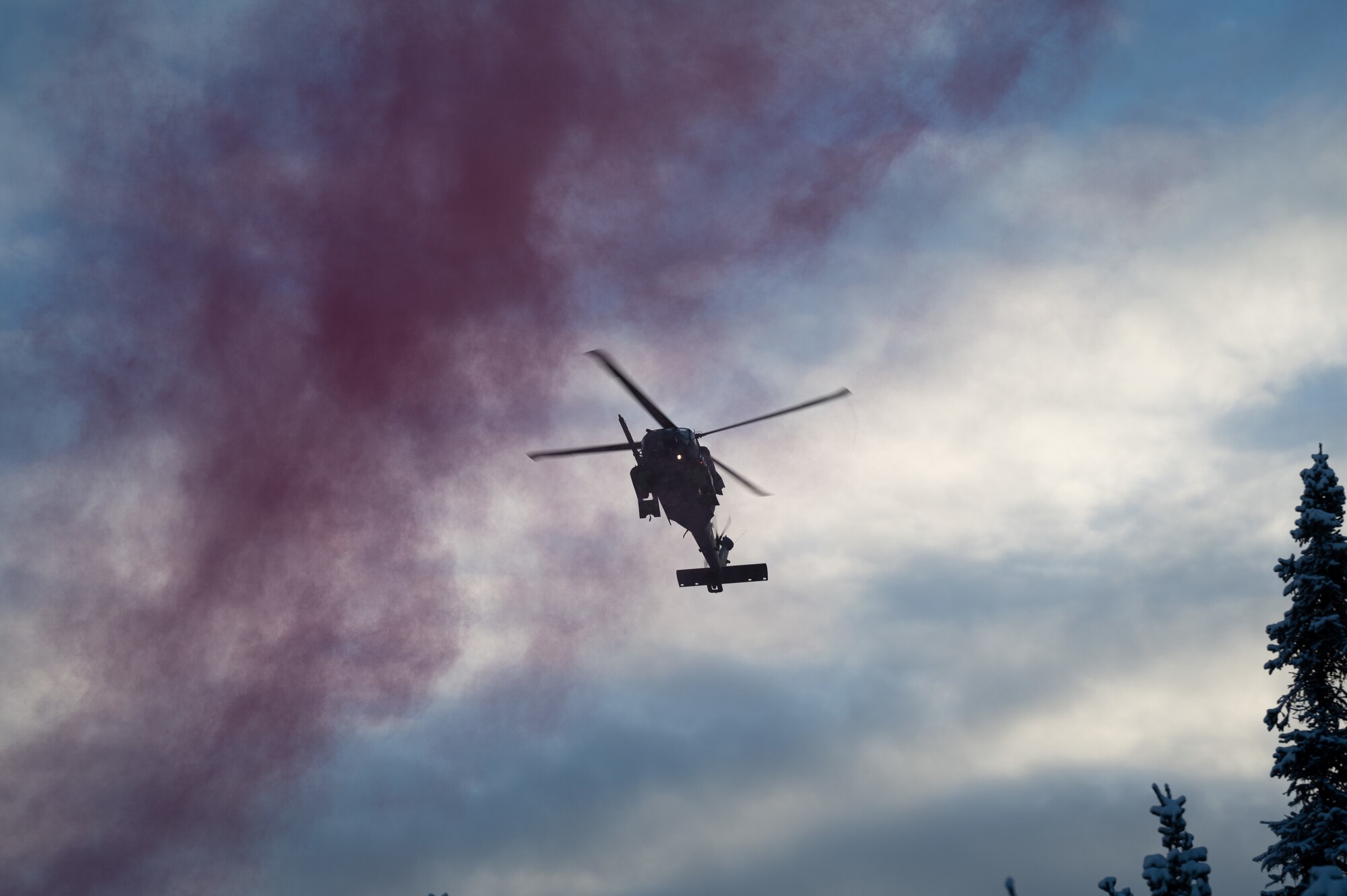 A U.S. Air Force HH-60G Pavehawk helicopter assigned to the Alaska National Guard hovers over Eielson Air Force Base, Alaska during a recovery exercise, Nov. 18, 2021.