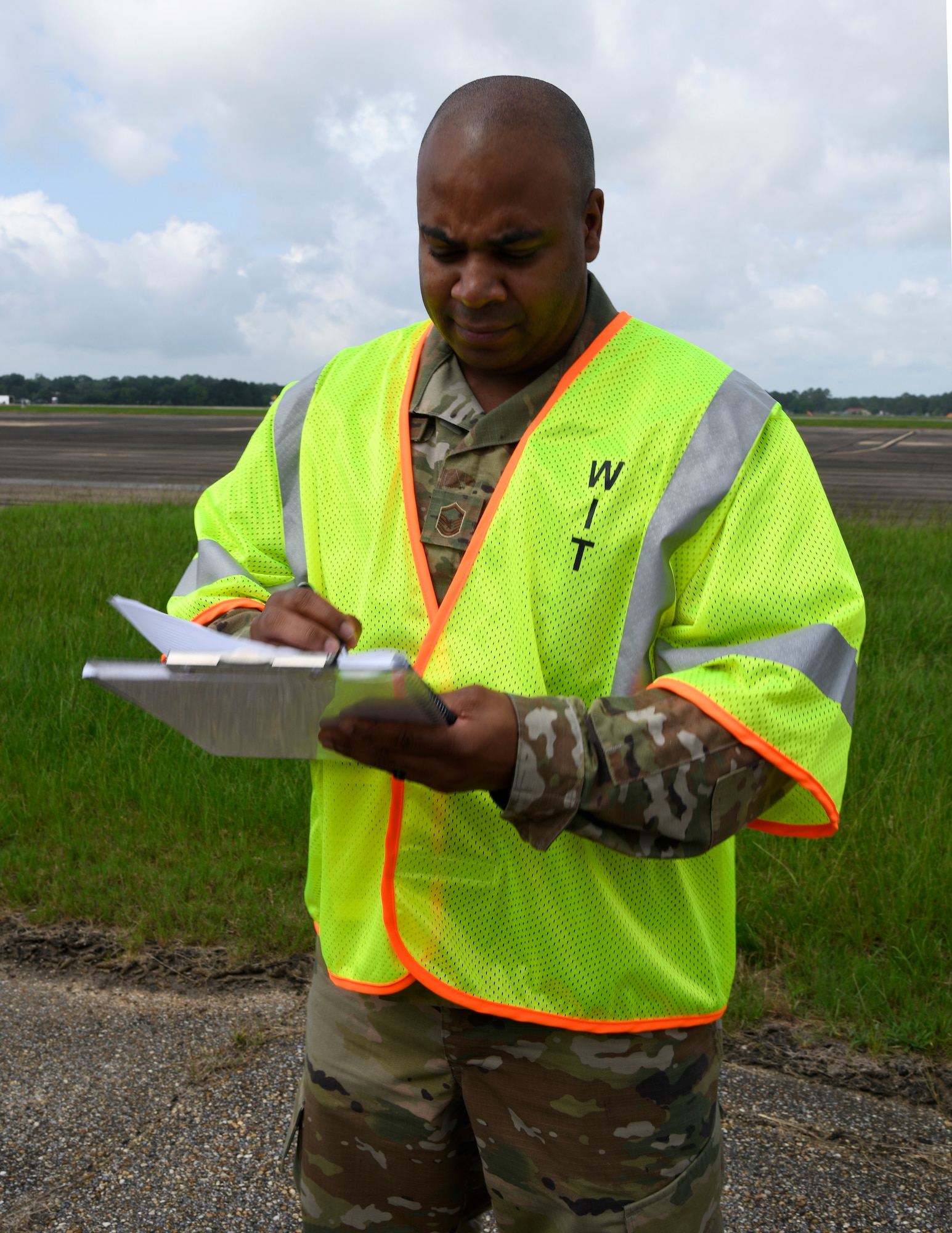 man writing notes