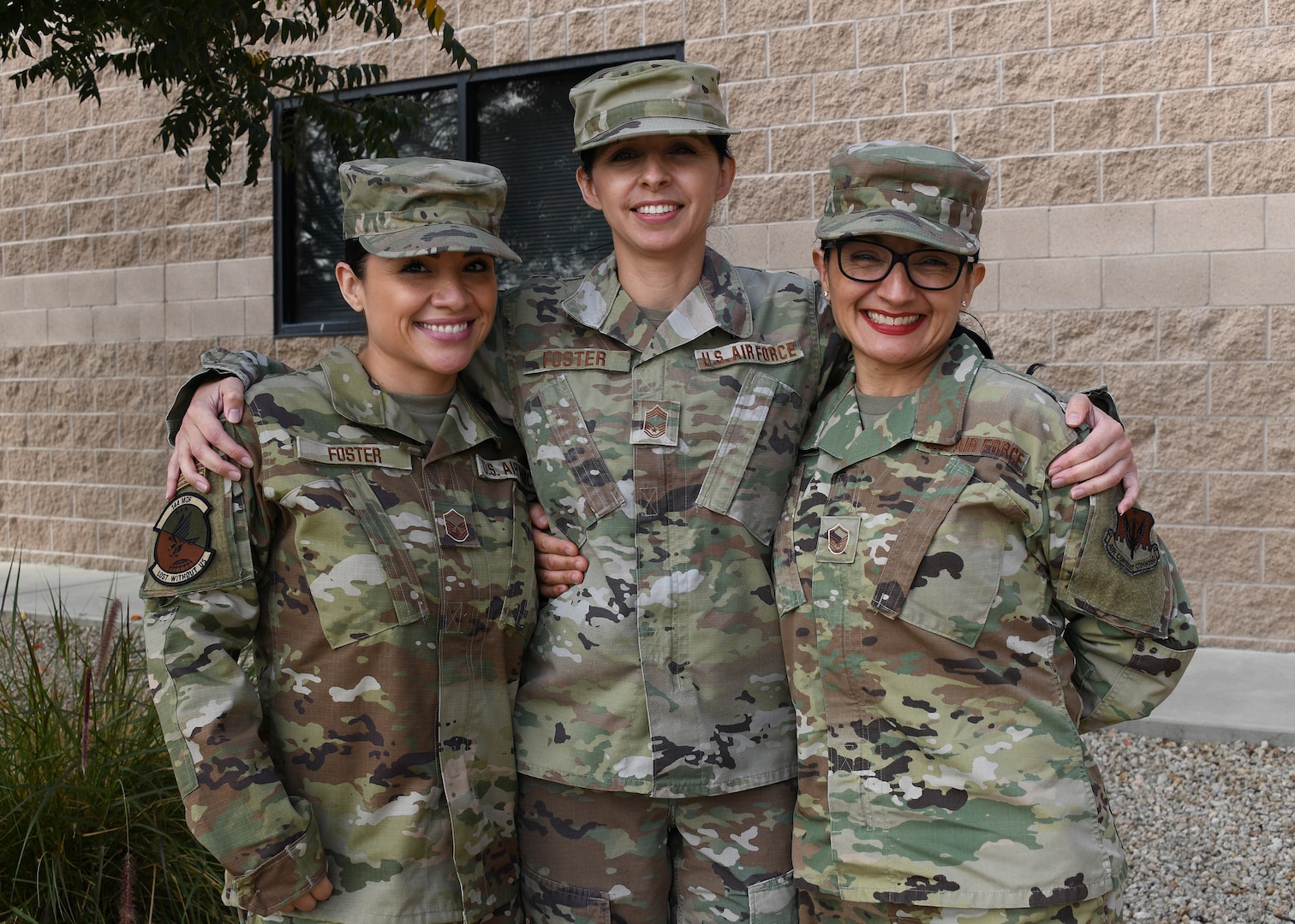From left, U.S. Air Force Master Sgt. Lindsay Foster, 144th Maintenance Squadron unit deployment manager, Chief Master Sgt. Diana Foster, 144th Force Support Squadron superintendent, and Master Sgt. Elida Foster, 144th Medical Group dental assistant, at the Fresno Air National Guard Base, Calif., Nov. 5, 2021. The Foster sisters have served at the 144th Fighter Wing since 2008.