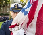 Cadet in front of Hamilton Hall at CG Academy