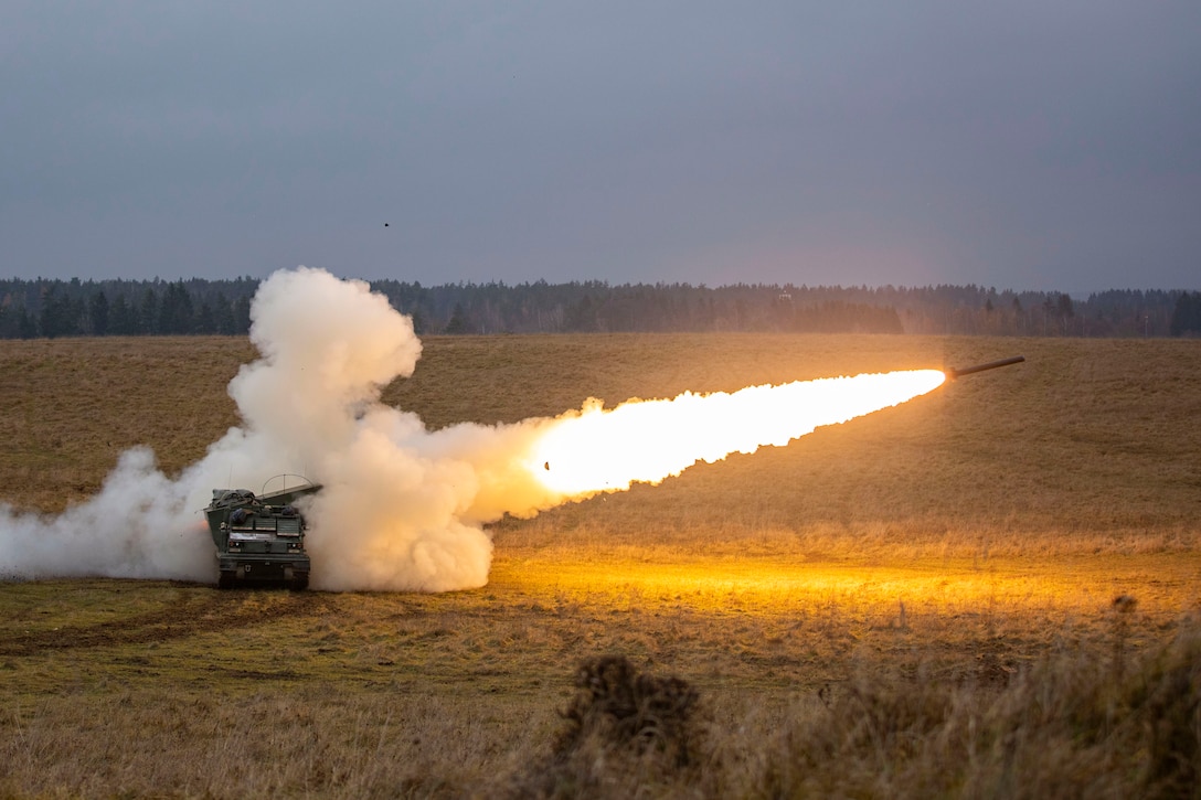 A rocket launches in a field.