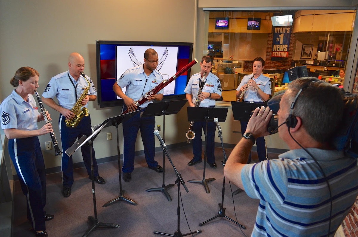 The U.S. Air Force Band Reed Quintet performs for a segment on a local television station in Salt Lake City, helping to promote a tour concert in the area on February 27, 2015. Pictured left to right are clarinetist Master Sgt. Brooke Emery, saxophonist Master Sgt. Jeremy Koch, bassoonist Technical Sgt. (ret.) Eddie Sanders, bass clarinetist Master Sgt. (ret.) John Romano and oboist Technical Sgt. Emily Foster.
