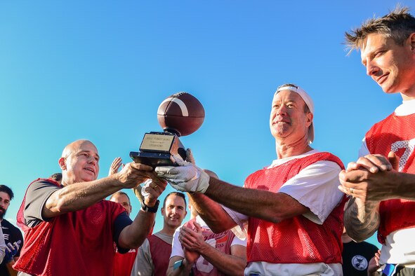 U.S. Space Command and Joint Task Force-Space Defense team members play flag football during inaugural Space Turkey Bowl.