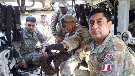 Brig. Gen. Carlos Bojorquez, Peruvian Army 1st Multipurpose Brigade commander, right, is given a briefing on the capabilities of the M1126 Infantry Carrier Vehicle Stryker from a trooper assigned to 3rd Squadron, 3d Cavalry Regiment at Fort Hood, Texas, Nov. 17, 2021. The Peruvian Army delegation observed the 3d Cavalry Regiment Strykers as part of an agreed-to-action deriving from the U.S.-Peruvian Army-to-Army Staff Talks.