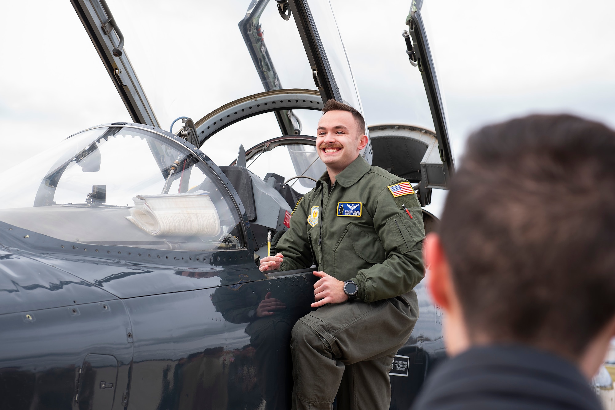 Air Force ROTC Cadet Dylan Shope poses next to the cockpit of a T-38 Talon aircraft Nov. 15, 2021, at Wright-Patterson Air Force Base, Ohio. The supersonic trainer aircraft was flown to Wright-Patt by Maj. Sarah Kociuba, a 393rd Bomb Squadron pilot who visited local cadets. (U.S. Air Force photo by R.J. Oriez)