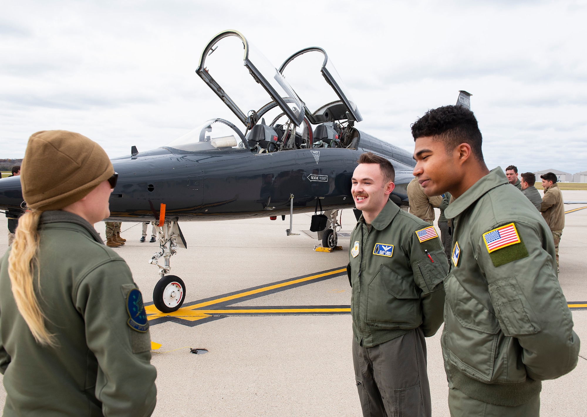 Maj. Sarah Kociuba, 393rd Bomb Squadron pilot, visits with Air Force ROTC cadets Dylan Shope (left) and Chris Davis on Nov. 15, 2021, at Wright-Patterson Air Force Base, Ohio. Kociuba, who led the three-bomber flyover at the Super Bowl in February, came back to Wright-Patt to visit with cadets from the ROTC unit she was a member of 10 years ago. (U.S. Air Force photo by R.J. Oriez)