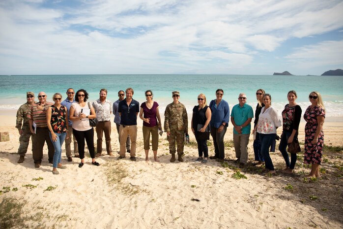Department of Defense and civilian leaders pose for a group photo during a joint staff meeting, Bellows Air Force Station, Hawaii, Nov. 9, 2021. The meeting was held in an effort to gain a better understanding of shared topics of interest with regards to the Bellows area. (U.S. Marine Corps photo by Cpl. Brandon Aultman)