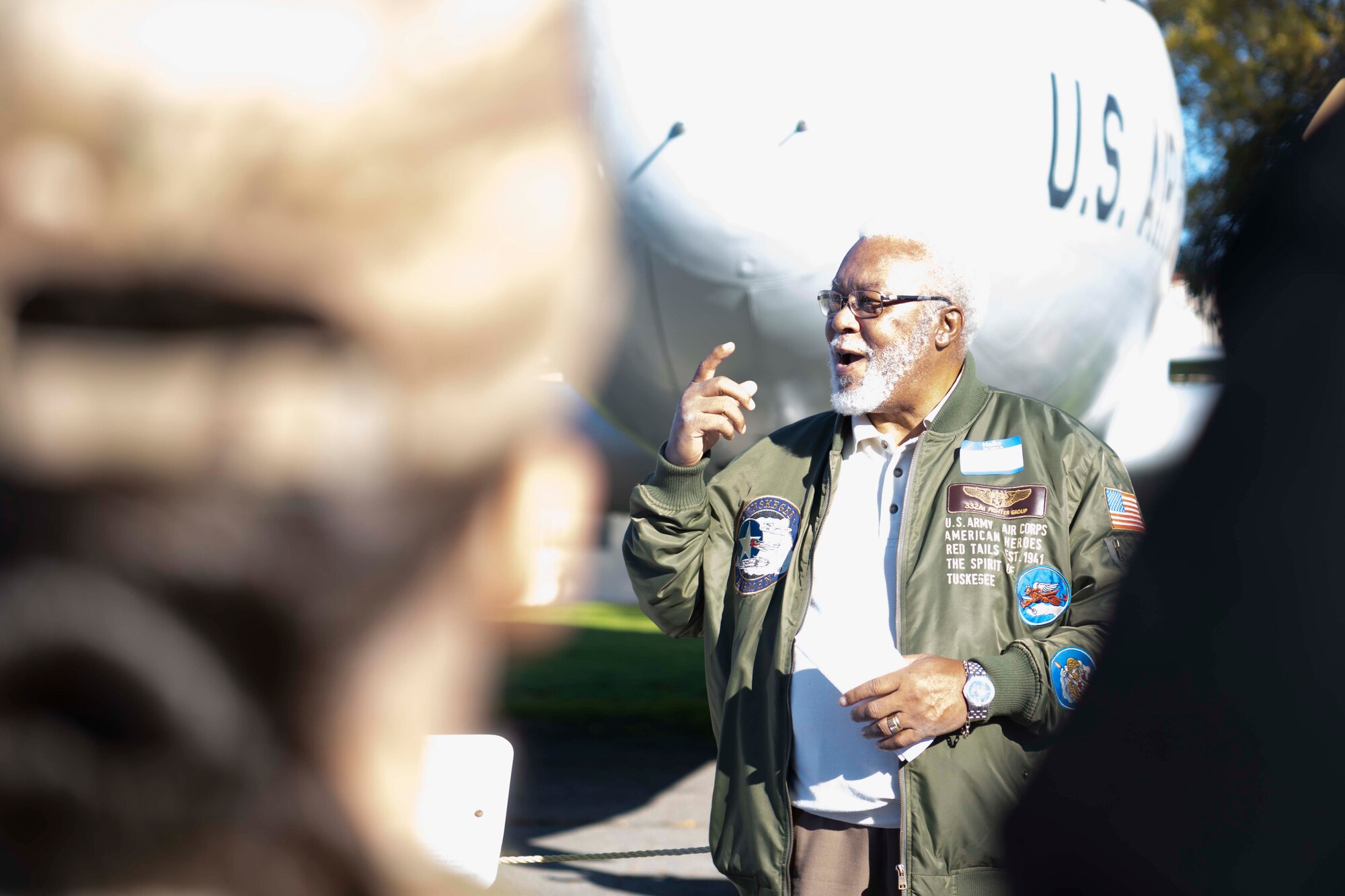 A man talks to a group of people