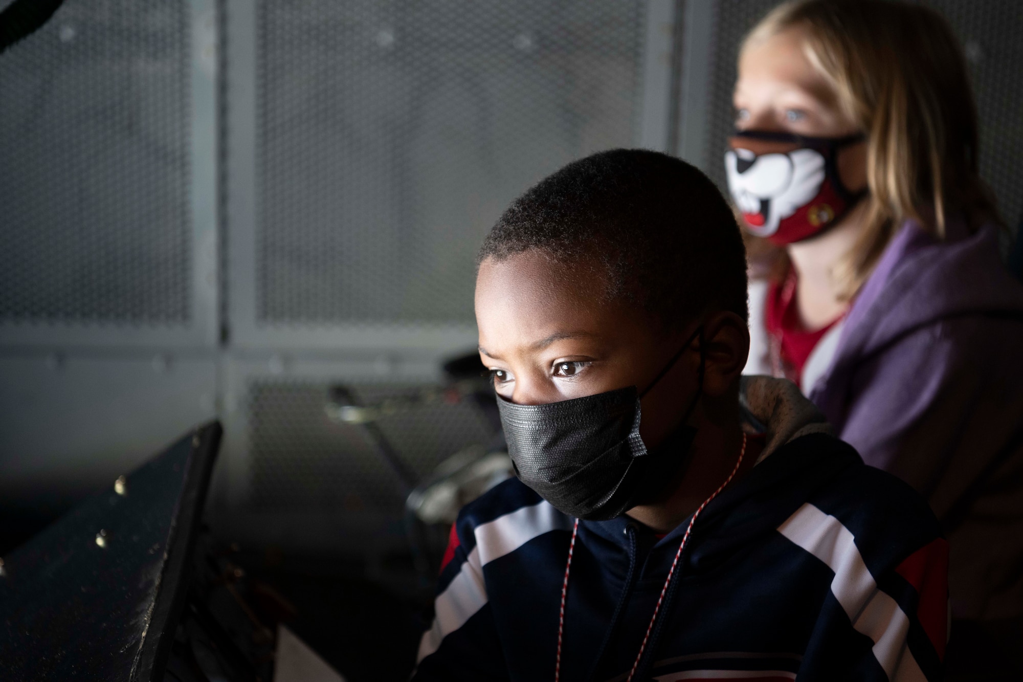 youths tour the inside of an aircraft