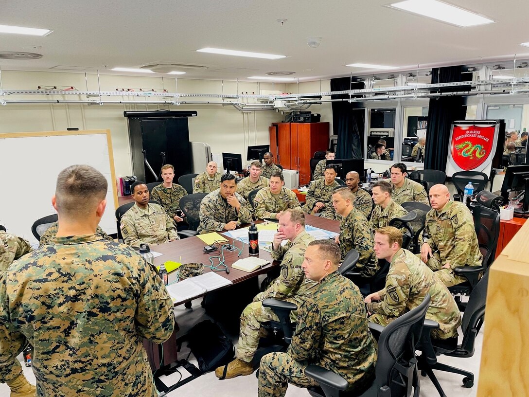 U.S. Marine Corps Maj. Alex Butta, Future Operations Planner, 3rd Marine Expeditionary Brigade, briefs members with Maneuver Advisor Team 5310, Force Package 22-1, 5th Security Force Assistance Brigade, as well as other MEB planning staff aboard Camp Courtney, in Okinawa, Japan, Nov. 19, 2021 in preparation for participation in Yama Sakura 81. Yama Sakura 81 is the largest U.S.-Japan bilateral and joint command post exercise which enables participants to work as dedicated partners in support of the Japan-U.S. security alliance and for continued peace and stability in the Indo-Pacific. This year’s exercise commemorates the 40th anniversary of Yama Sakura.