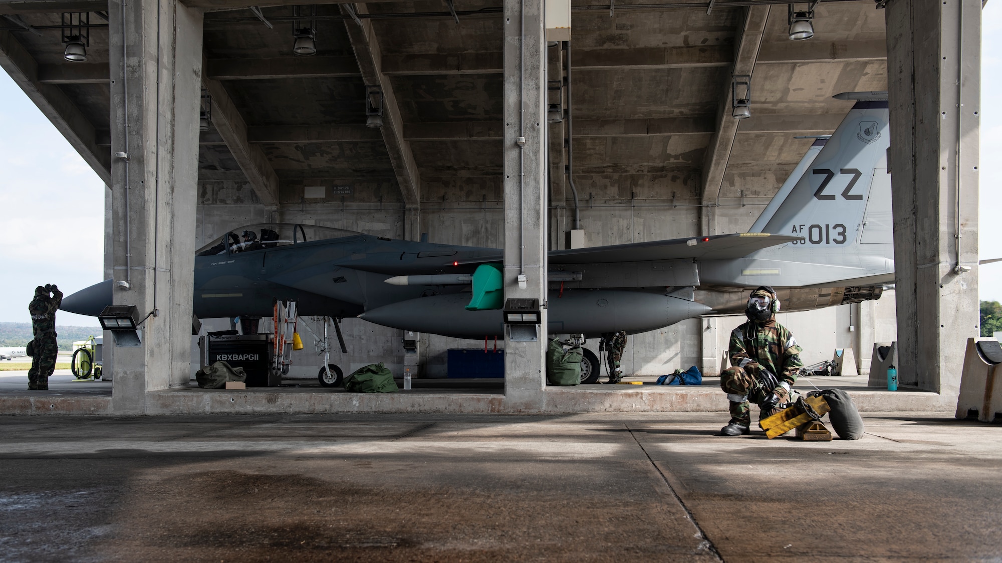 Senior Airman Chancelor Slade, 18th Aircraft Maintenance Squadron avionics journeyman, waits for an aircraft to return from a sortie during an ability to survive and operate training exercise at Kadena Air Base, Japan, Nov. 17, 2021. The 18th Wing is postured to respond to demanding scenarios, and continuously focuses on keeping forces ready for high-end missions through daily training and readiness exercises. (U.S. Air Force photo by Senior Airman Jessi Monte)