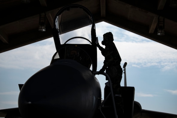 Airman 1st Class Samuel Graeser, 44th Aircraft Maintenance Unit crew chief, decontaminates an F-15C Eagle during an ability to survive and operate training exercise at Kadena Air Base, Japan, Nov. 17, 2021. The decontamination process is used in the event an aircraft has been exposed to a chemical or biological agent during flight. (U.S. Air Force photo by Senior Airman Jessi Monte)