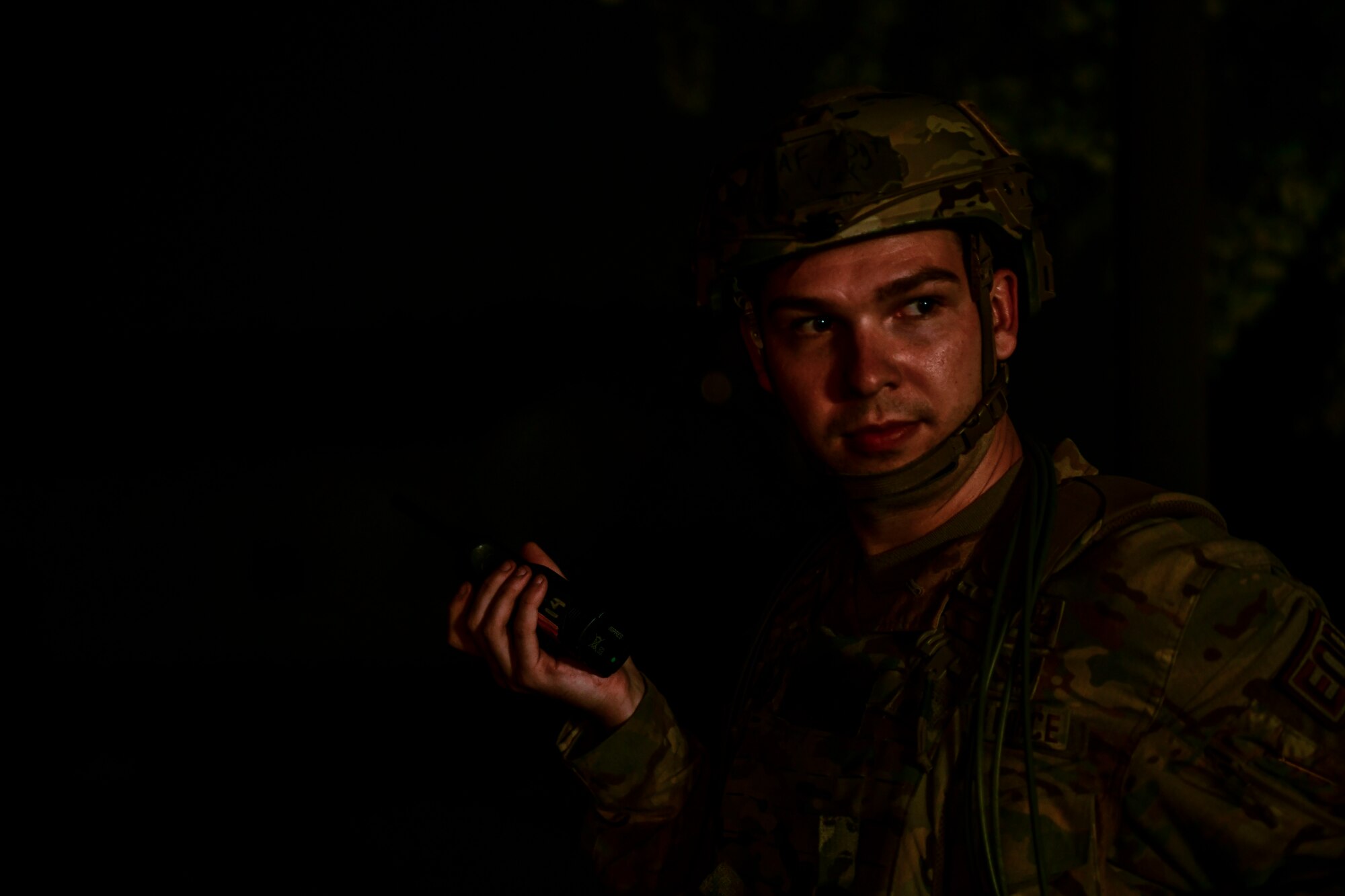 Staff Sgt. Ryan Vick, 8th Civil Engineer Squadron explosive ordnance disposal technician, reports tactful plans over land mobile radio during a simulated unexploded ordnance alert call routine training at Kunsan Air Base, Republic of Korea, Nov. 4, 2021. EOD specialists are trained to detect, disarm and dispose of explosive threats in the most extreme environments and serve as the U.S. Air Force’s bomb squad. (U.S. Air Force photo by Staff Sgt. Jesenia Landaverde)