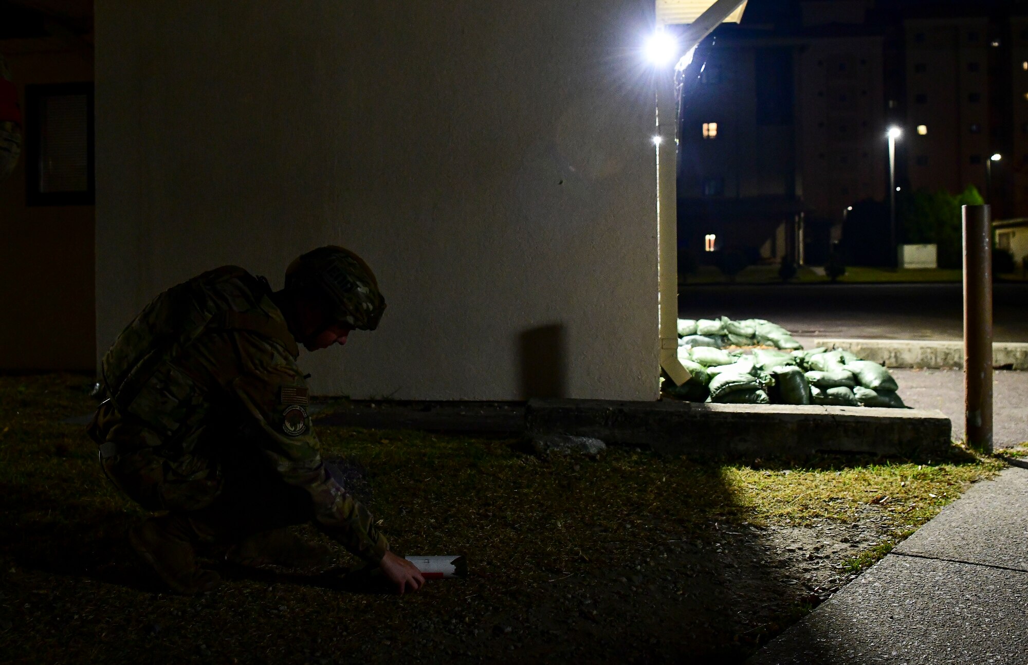 Staff Sgt. Ryan Vick, 8th Civil Engineer Squadron explosive ordnance disposal technician, sets down simulated explosive during a simulated unexploded ordnance alert call at Kunsan Air Base, Republic of Korea, Nov. 4, 2021. EOD specialists are trained to detect, disarm and dispose of explosive threats in the most extreme environments and serve as the U.S. Air Force’s bomb squad. (U.S. Air Force photo by Staff Sgt. Jesenia Landaverde)