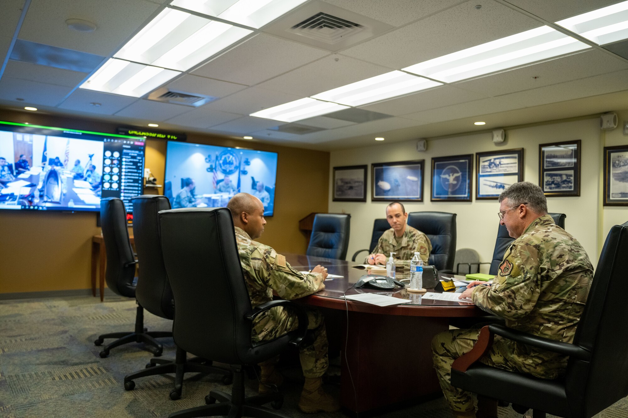 Photo of Airmen in a conference room