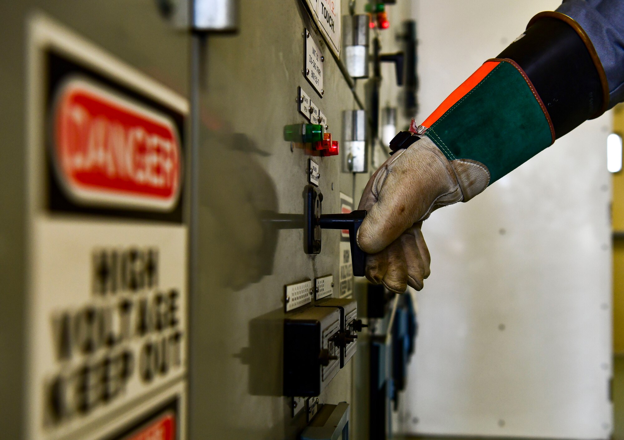 Staff Sgt. Patrick Smith, 8th Civil Engineer Squadron electrical systems technician, powers down a high voltage switch at Kunsan Air Base, Republic of Korea, Nov. 4, 2021. The 8th CES electrical power production unit and 8th Logistics Readiness Squadron fuels flight test their ability to provide power to the base with BPUs, which run on fuel. (U.S. Air Force photo by Staff Sgt. Jesenia Landaverde)