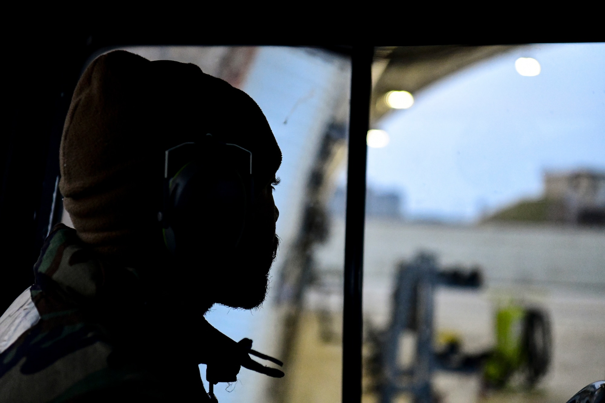 An Airman drives a tow truck.