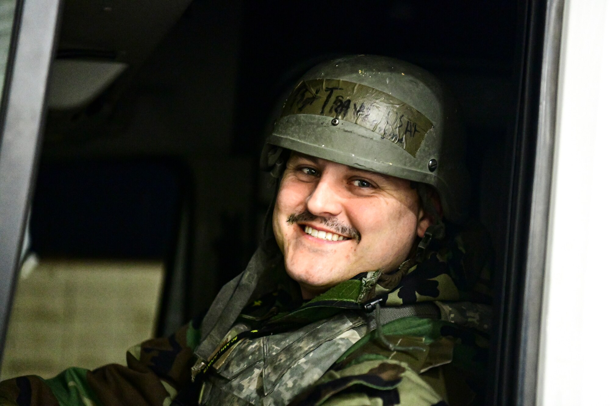 An Airman drives down the flightline.