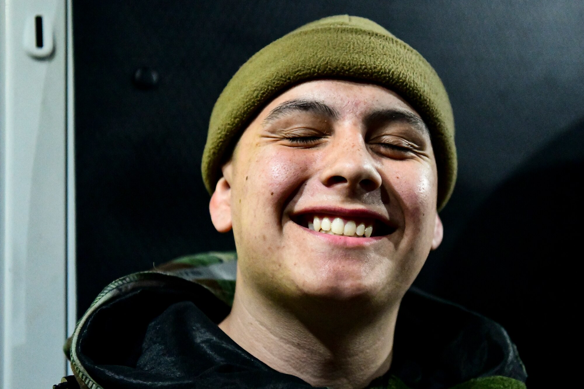 An Airman smiles.