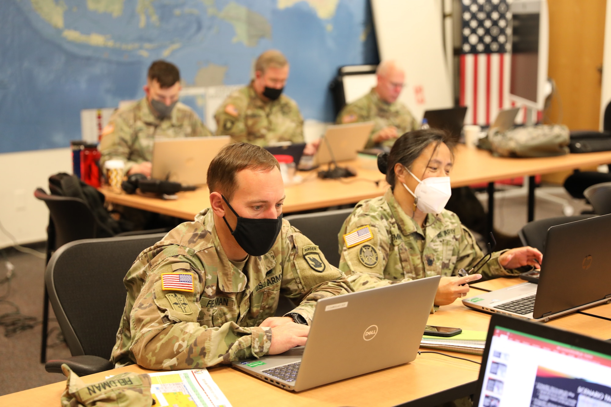 Washington Army National Guard Lt. Cols. Scott Fieldman and Reena Emme work virtually with their counterparts from the Malaysian Armed Forces during Exercise Bersama Warrior '21 from Joint Base Lewis McChord, Washington, Nov. 14, 2021.