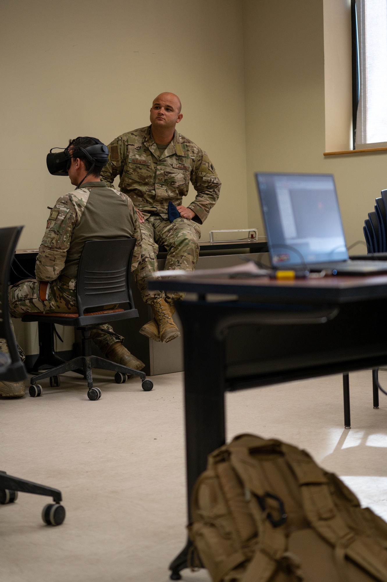 U.S. Air Force Technical Sgt. Edward Newberrn, 23rd Special Tactics Squadron combat controller, evaluates joint terminal attack controllers from Spain on a virtual reality simulation during Bold Quest 21.2 at Muscatatuck Urban Training Center Nov. 6, 2021. Newbernn walked through training scenarios and how to work with AC-130J Ghostrider aircraft. (U.S. Air Force photo by Staff Sgt. Rito Smith)