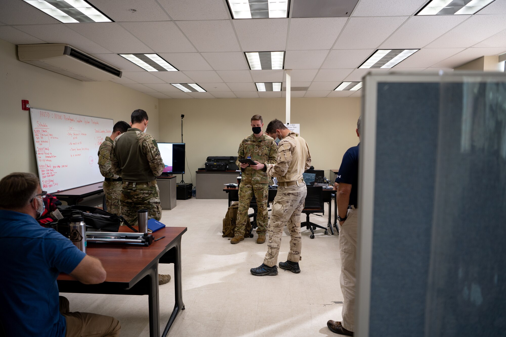 U.S. Air Force Captain Steve Middleton, 73rd Special Operations Squadron weapons system officer, briefs Spanish Air Force (Ejército del Aire) joint terminal attack controllers during Bold Quest 21.2 at Muscatatuck Urban Training Center Nov. 6, 2021. Middleton walked through training scenarios and how to communicate with aircrew during a call-to-fire mission. (U.S. Air Force photo by Staff Sgt. Rito Smith)