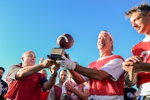 U.S. Space Command and Joint Task Force-Space Defense team members play flag football during inaugural Space Turkey Bowl.