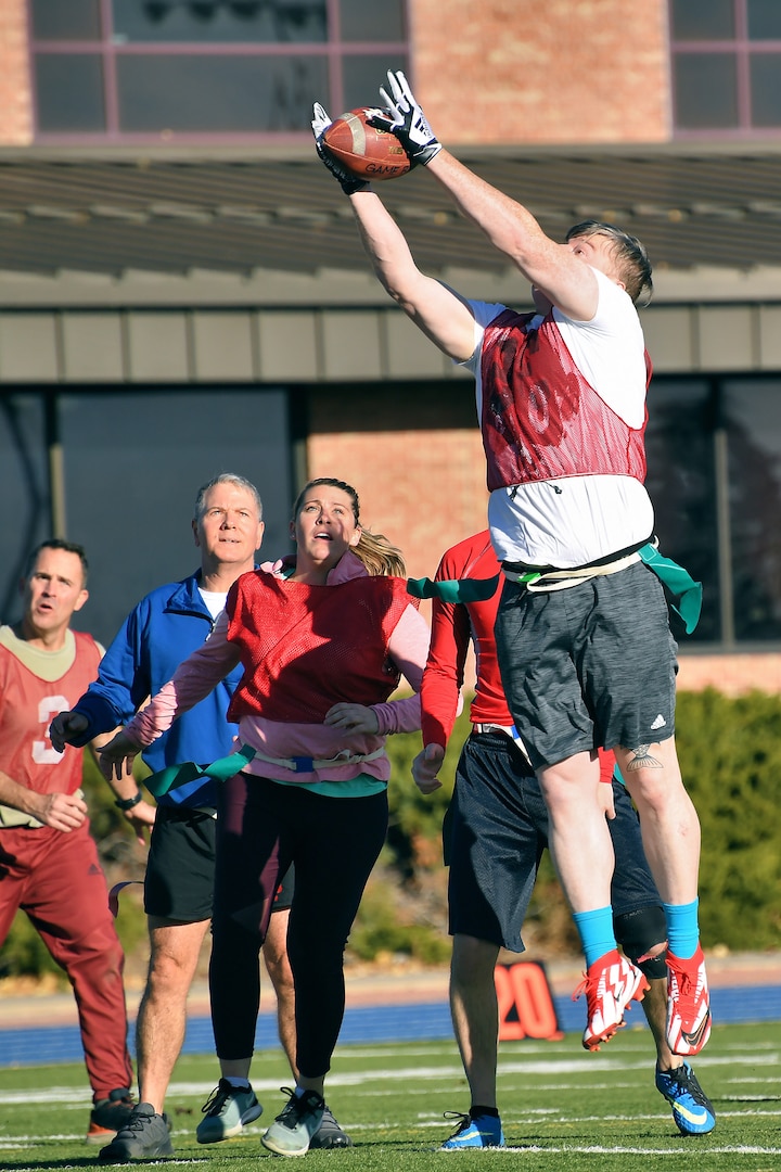 U.S. Space Command and Joint Task Force-Space Defense team members play flag football during inaugural Space Turkey Bowl.