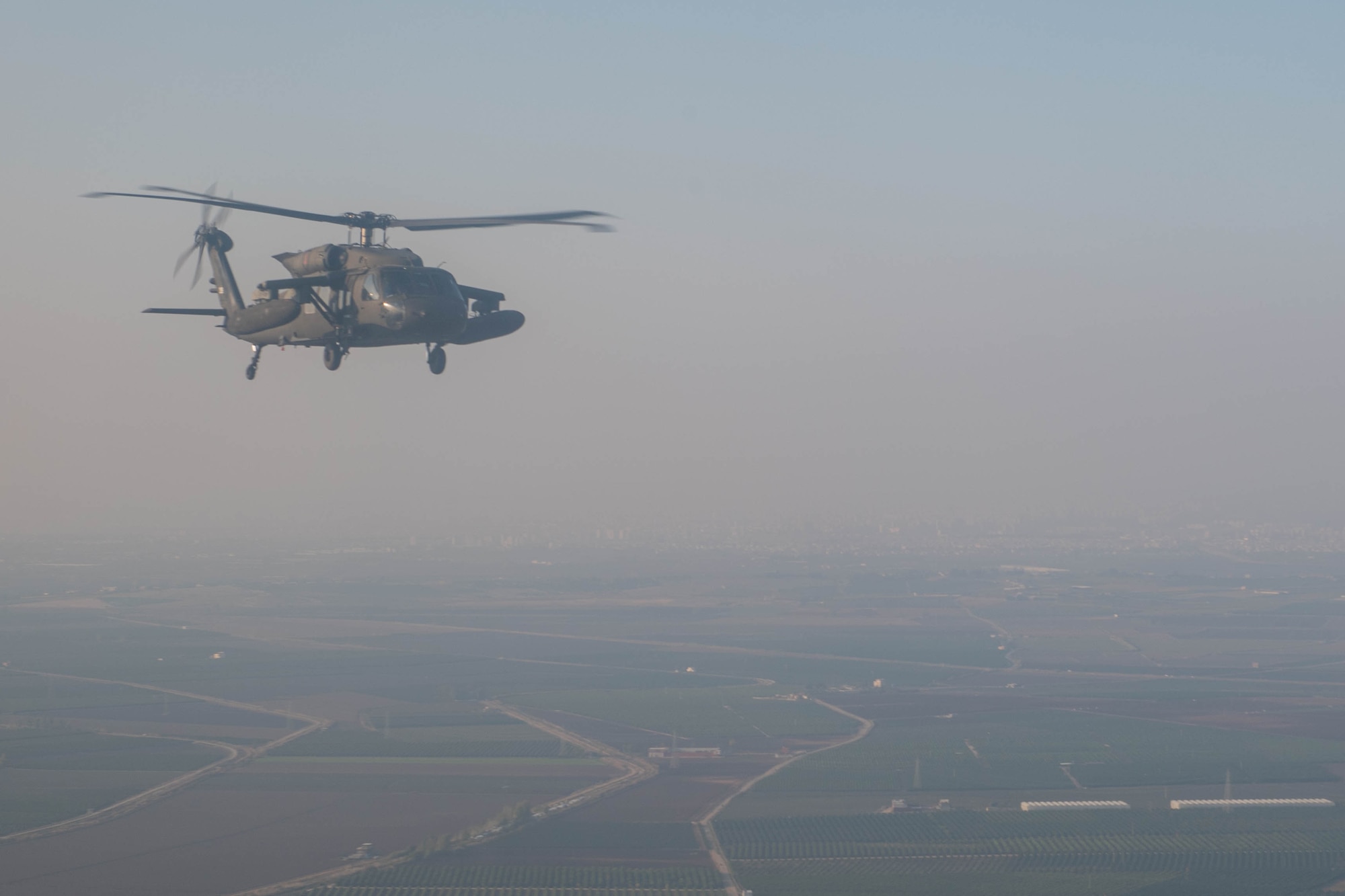 A UH-60 helicopter flies during a joint training exercise
