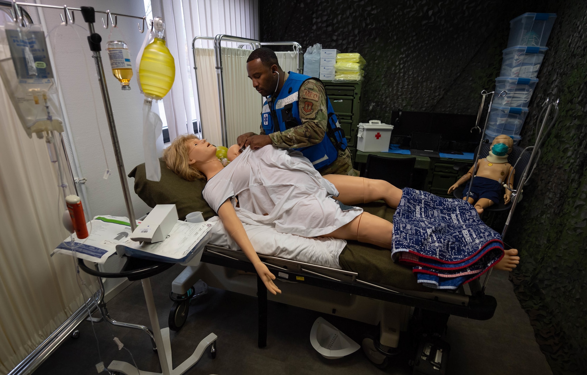 U.S. Air Force Staff Sgt. Lamaar Melvin, 86th Medical Squadron Labor and Delivery supervisor, practices labor and delivery procedures in a simulation room at Ramstein Air Base, Germany, Nov. 5, 2021. This simulation room is used for obstetrics training to better prepare Airmen for a real-life delivery of a child. (U.S. Air Force photo by Airman Jared Lovett)