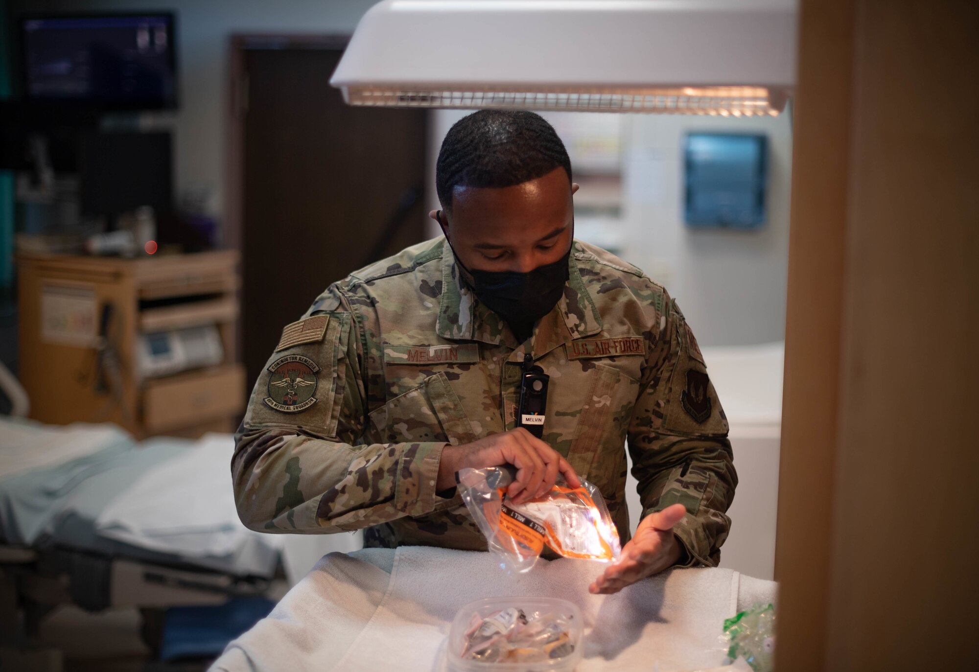 U.S. Air Force Staff Sgt. Lamaar Melvin, 86th Medical Squadron Labor and Delivery supervisor, checks intubation equipment near the neonatal warmer at the Landstuhl Regional Medical Center, Nov. 9, 2021. Employees at LRMC are required to check all equipment at a neonatal warmer at the start of each shift and before a patient delivers a child to ensure it is fully operational. The warmer is used to maintain the body temperature of newborn infants. (U.S. Air Force photo by Airman Jared Lovett)