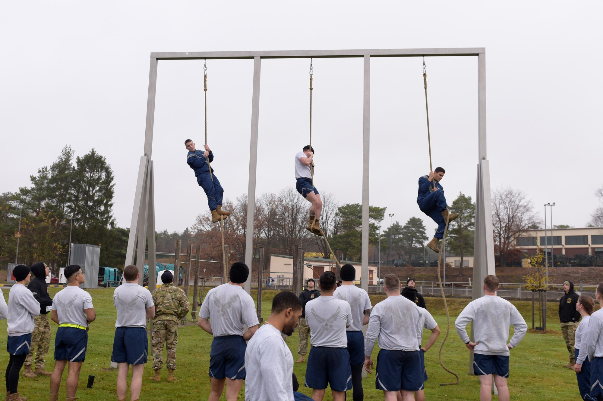 People climb a rope