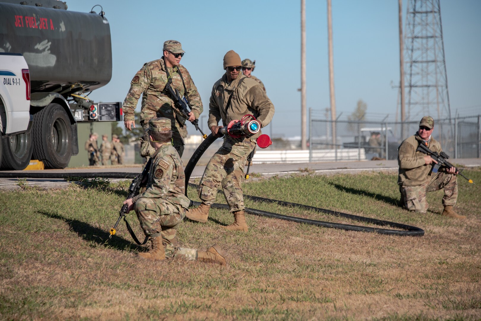 Master Sgt. Joshua Freeman, electrical systems specialist with the 137th Special Operations Civil Engineer Squadron, Oklahoma Air National Guard, pulls a fuel hose out to simulate refueling an aircraft during Mission Sustainment Team (MST) training at Will Rogers Air National Guard Base in Oklahoma City, Nov. 7, 2021. The MST concept brings individuals with a variety of skill sets together to create a sustained livable environment to independently support short-term operations in austere locations.