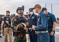 211105-N-UT641-0001 MEDITERRANEAN SEA (Nov. 05, 2021) Sailors assigned to the Tunisian Naval offshore patrol vessel TNS Jugurtha (P610) board the Arleigh Burke-class guided-missile destroyer USS The Sullivans (DDG 68) during a visit, board, search and seizure (VBSS) training exercise, Nov. 05, 2021. The Sullivans, homeported in Mayport, Fl,  is on a scheduled deployment in the U.S. Sixth Fleet area of operations in support of U.S. national security interests in Europe and Africa. (U.S. Navy photo by Mass Communication Specialist 3rd Class Janiel Adames)