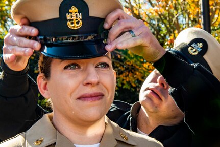 Chief Mass Communication Specialist Kathryn Macdonald, assigned to Commander, Naval Air Force Atlantic (CNAL), receives her cover