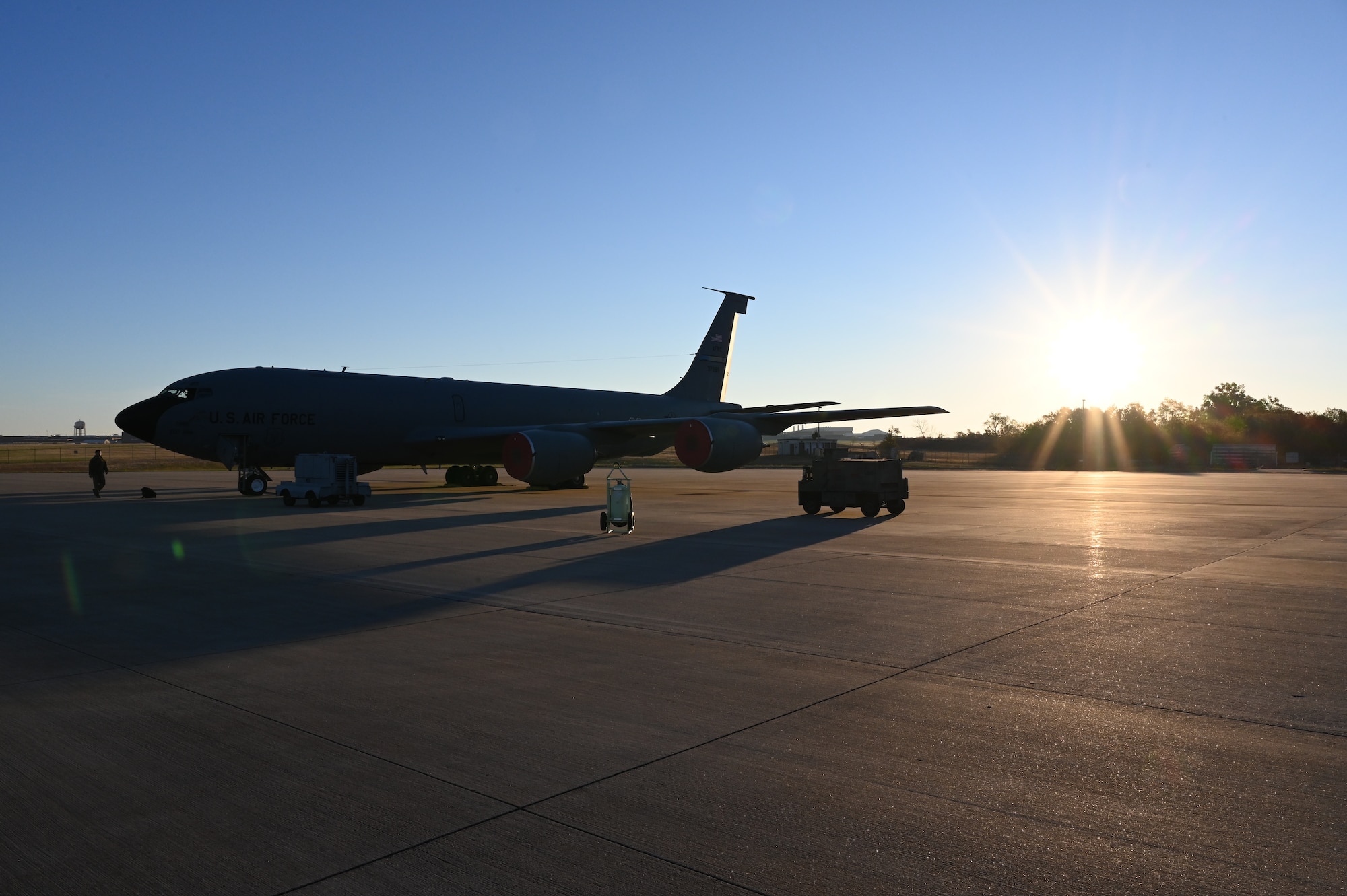 A KC-135 Stratotanker sits on the ramp being inspected during the Global Thunder exercise, Nov. 7, 2021, on Tinker Air Force Base, Oklahoma. Global Thunder is a is a U.S. Strategic Command annual nuclear command and control and field training exercise. (U.S. Air Force photo by Master Sgt. Grady Epperly)