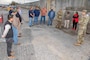 IN THE PHOTO, Memphis District Leadership, project partners, and project delivery team members gather for a ribbon cutting ceremony celebrating the completion of significant projects involving the replacement of culverts in both the northern and southern sides of the Mound City Pump Station and the installation of several relief wells in Mound City through Cairo. (USACE PHOTO/ Vance Harris)