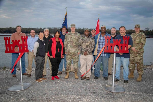 IN THE PHOTO, Memphis District Leadership, project partners, and project delivery team members gather for a ribbon cutting ceremony celebrating the completion of significant projects involving the replacement of culverts in both the northern and southern sides of the Mound City Pump Station and the installation of several relief wells in Mound City through Cairo. (USACE PHOTO/ Vance Harris)