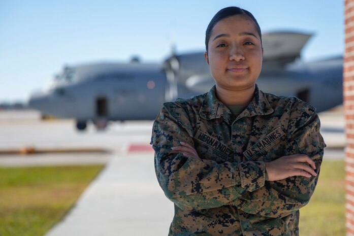 U.S. Marine Corps Lance Cpl. Vanessa Hernandez, an aviation operations supervisor with Headquarters and Headquarters Squadron, Marine Corps Air Station New River, poses for a photo on MCAS New River in Jacksonville, North Carolina, Nov. 23, 2021.