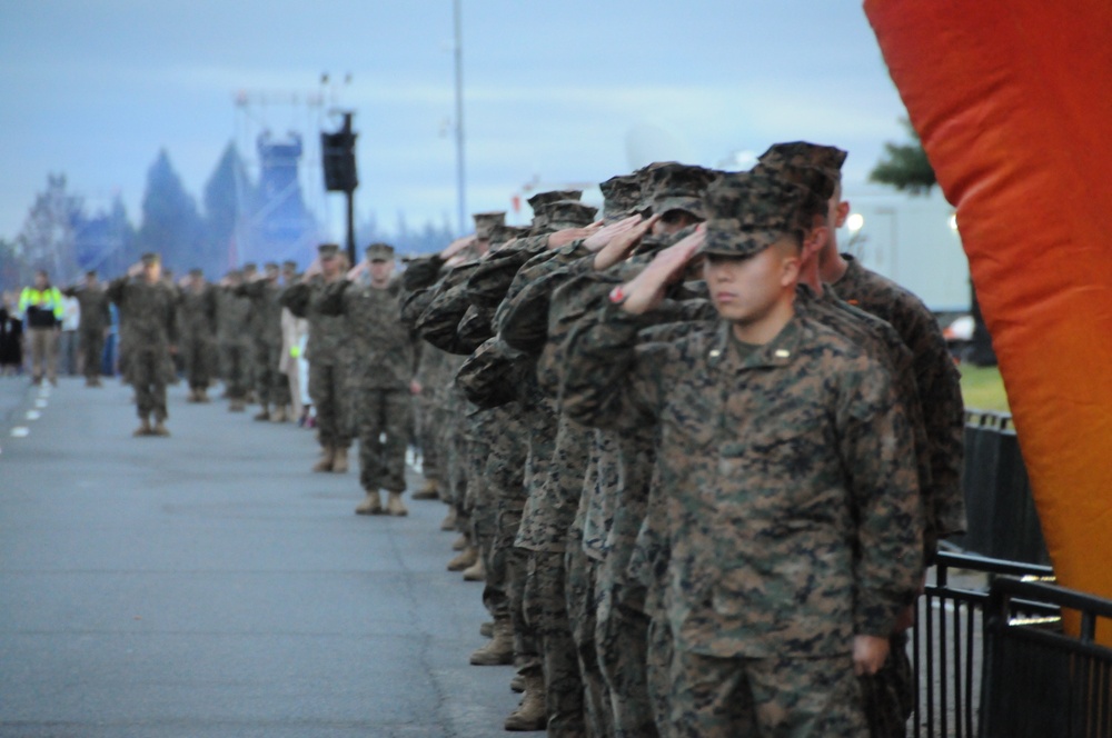 Marines outside saluting.