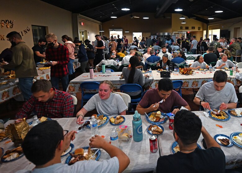 Goodfellow students enjoy each other’s company and their food during a Thanksgiving event at the Crossroads on Goodfellow Air Force Base, Texas, Nov. 23, 2021. Over 150 students were served during the Thanksgiving dinner. (U.S. Air Force photo by Senior Airman Michael Bowman)