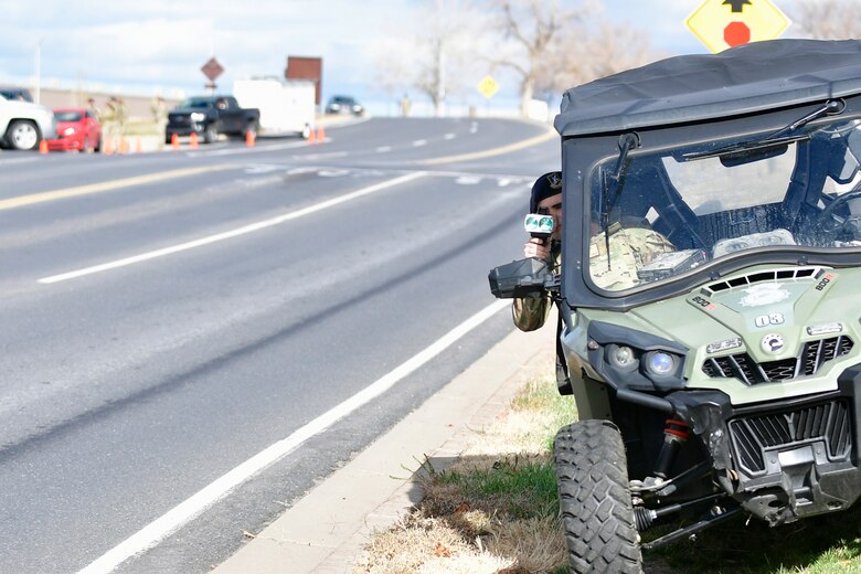 Vehicle speeds are clocked by a Defender sitting in an ATV.