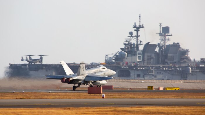 A U.S. Marine Corps F/A-18C Hornet aircraft with Marine Fighter Attack Squadron 112 takes off from Marine Corps Air Station Iwakuni, Japan, Nov. 18, 2021. VMFA-112 participated in a joint maritime strike rehearsal with the U.S. Navy off the coast of Okinawa, Nov 19, 2021. U.S. Marines with VMFA-112 routinely train and rehearse joint maritime mission sets in order to maintain readiness to carry out a wide range of operational tasks in a region characterized by vast oceans, seas, and waterways.