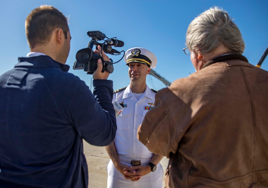 Cmdr. James Diefenderfer, commanding officer of the Arleigh Burke-class guided-missile destroyer USS The Sullivans (DDG 68), speaks with civilian media outlets after returning from a seven-month world deployment with the United Kingdom's HMS Queen Elizabeth (R08) Carrier Strike Group, Nov. 24, 2021.