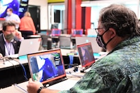 IMAGE: – Dr. George Foster, the Navy’s Distinguished Engineer for Combat Control, plays Simulated Practice Integrating New Technologies (SPRINT) during a wargaming event at Naval Surface Warfare Center Dahlgren Division. SPRINT is a game which allows users to defend a designated ship using an array of weapons systems.